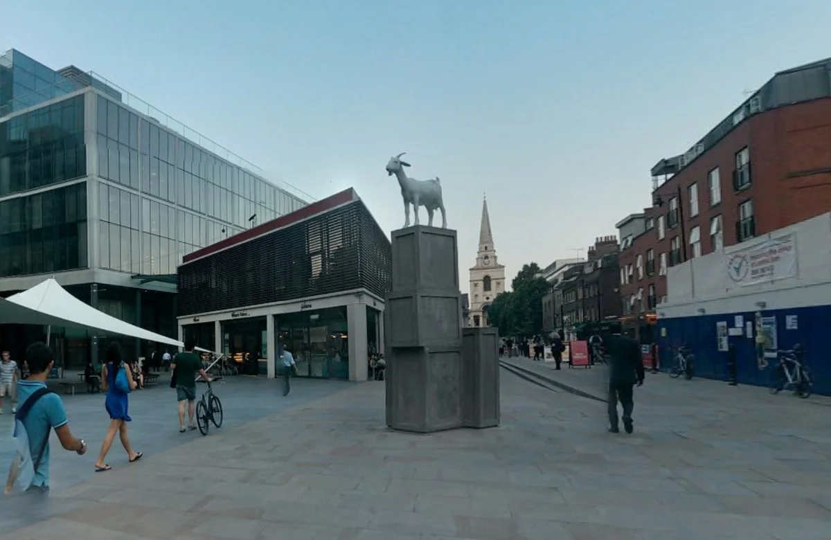 A goat on top of boxes in Old Spitalfields Market