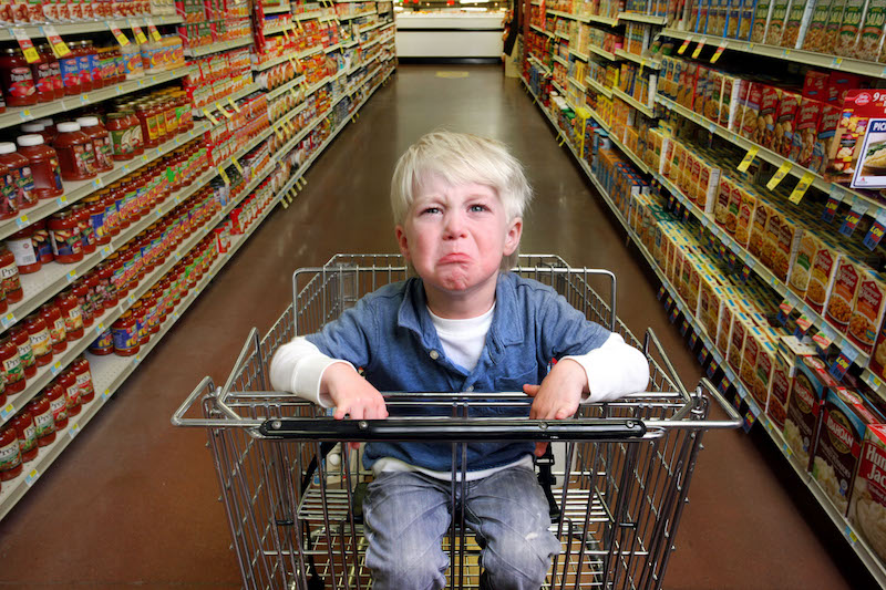 Kid having tantrum in supermarket
